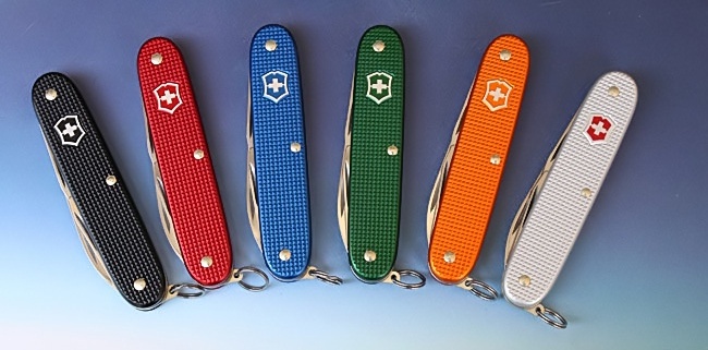 The full range of colours available for Victorinox Pioneer knives. 
Black - 0.8201.23R4
Red - 0.8201.20R4
Blue - 0.8201.22R4
Green - 0.8201.24R4
Orange - 0.8201.79R4
Silver - 0.8201.26 