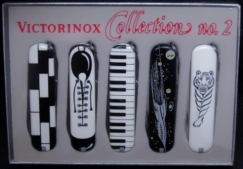 A Victorinox B&W Art Deco styled series of knives featuring 5 different designs on Cellidor scaled 74mm Ambassador w/keyring models.