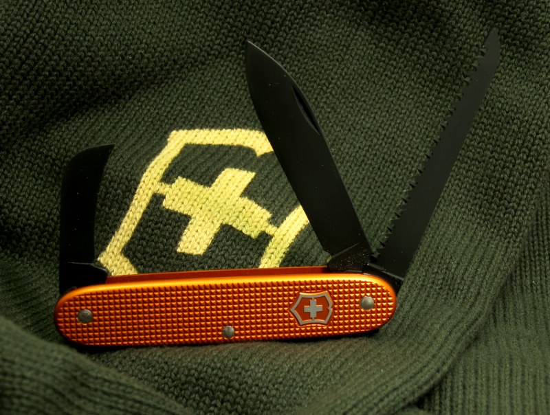 A Orange Alox scaled Wilderness with black oxide coated tools, springs and liners. Produced as part of a special-run of 50 knives in October 2010.  