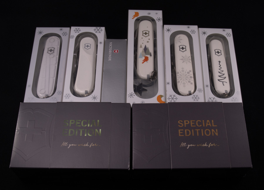 Victorinox Christmas Series boxed. Top line from left to right: Climber White Christmas 2015, Evolution White Christmas Special Edition 2016, Climber Christmas Knife "Make a Wish" Special Edition 2016, Super Tinker Winter Magic Special Edition 2019, Explorer White Christmas Special Edition 2017, Sportsman White Christmas Special Edition 2018. Bottom line from left to right: Climber Christmas Knife "All you wish for..."  Special Edition 2018.