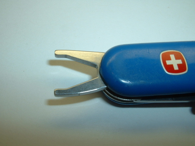 This is the Shoe Spike Wrench on a Wenger Golf Pro model SAK. It is used to tighten or loosen a spike from a golfers shoes.